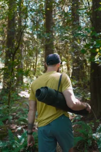 Dave walking in the forest with his eco-friendly Supported Soul yoga mat (Photo credit: Haley Bowen)