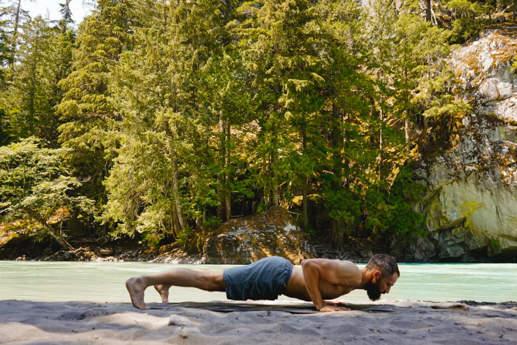 Dave in a low plank by the river